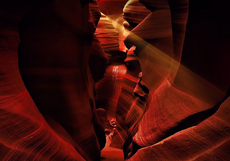 Sunbeams in the red walls of the canyon