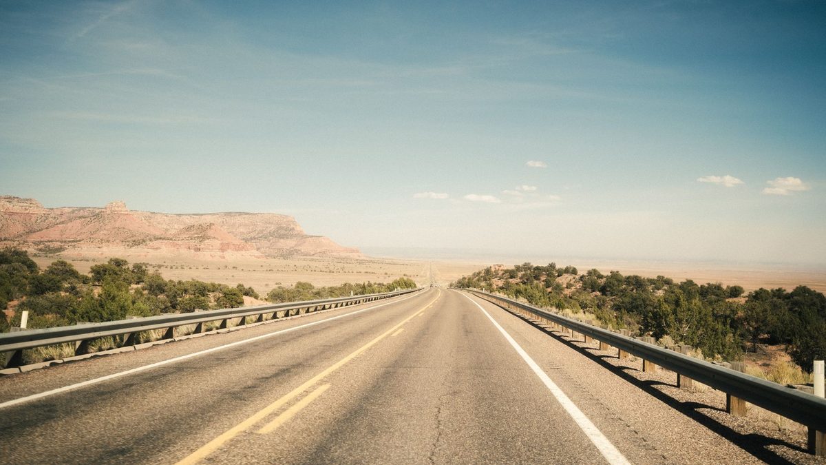 A long empty road through the Arizona desert