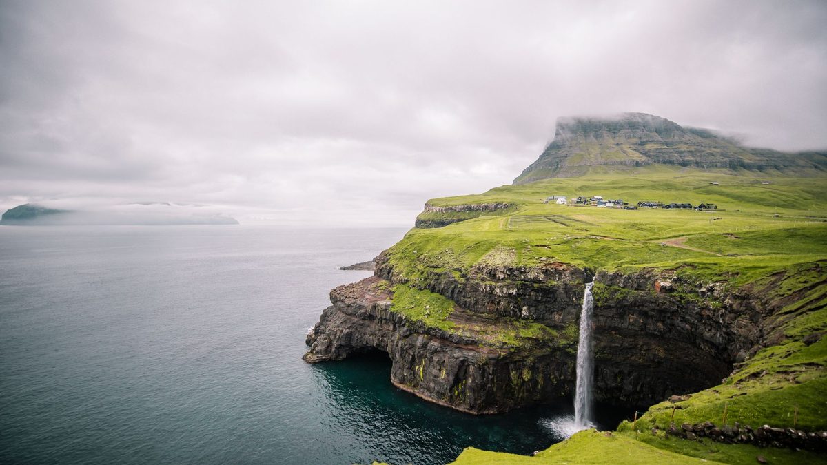 Soft morning light over green cliffs and the Atlantic