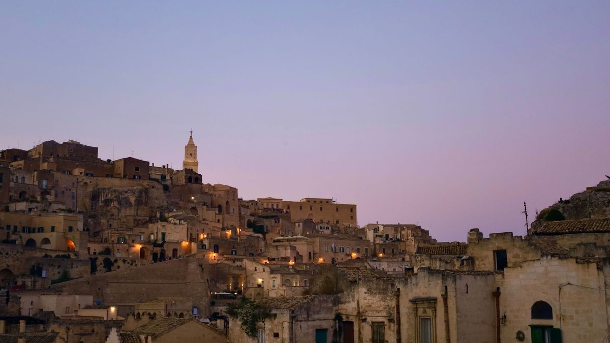 The old town at dusk under a purple sky
