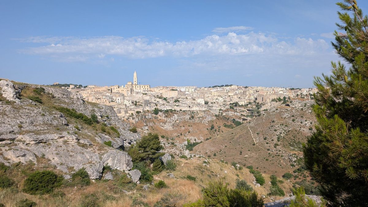 Matera across the Gravina ravine under a blue sky