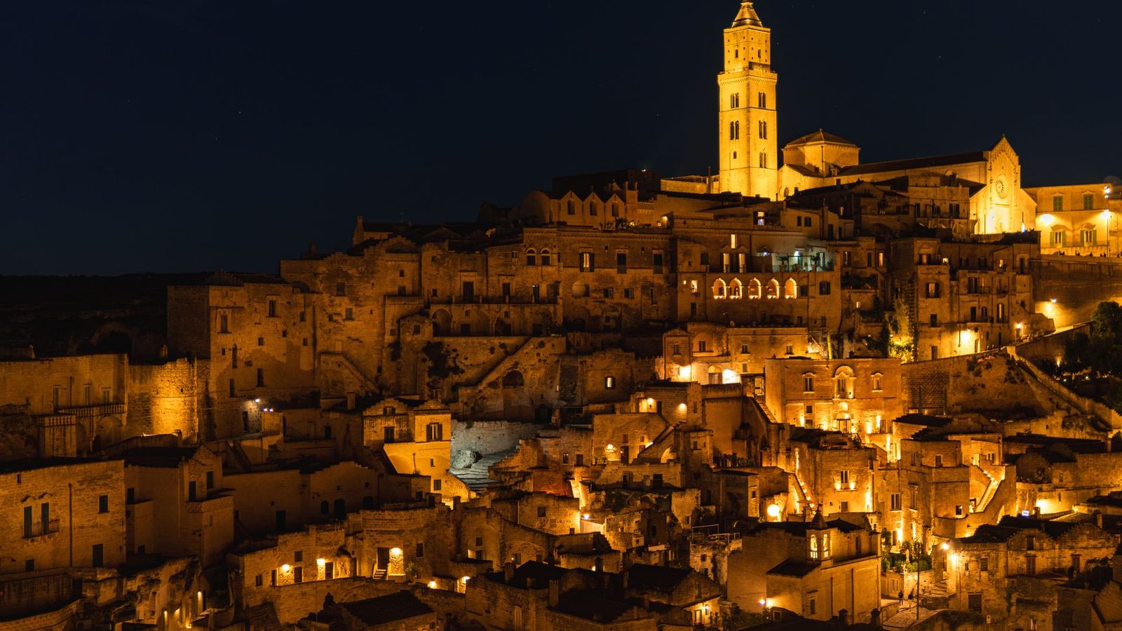 The old town of Matera glowing at night