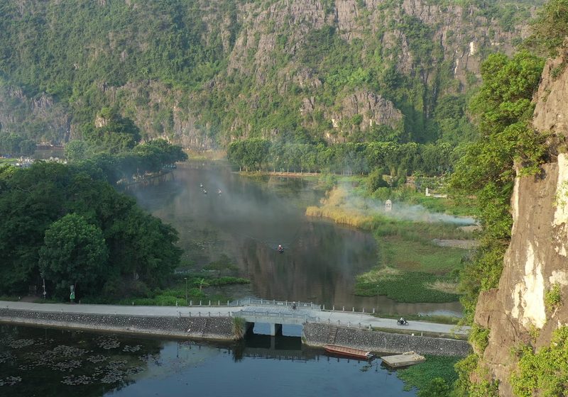 A river curving between green hills