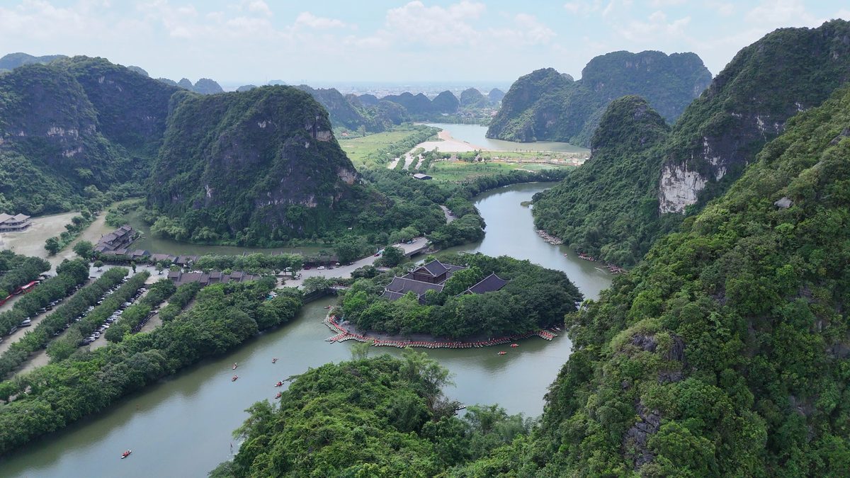 A river curving between peaks in late light