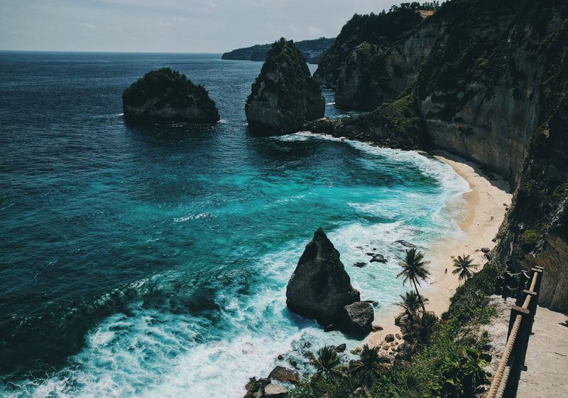 Rock stacks in the sea beside a cliff