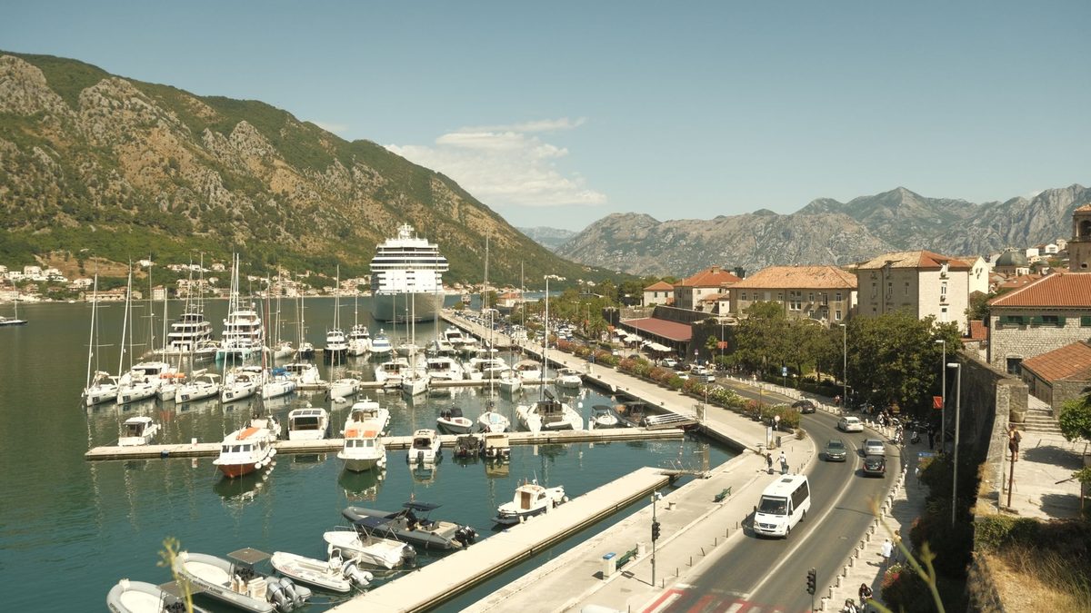 Kotor harbour with boats and mountains