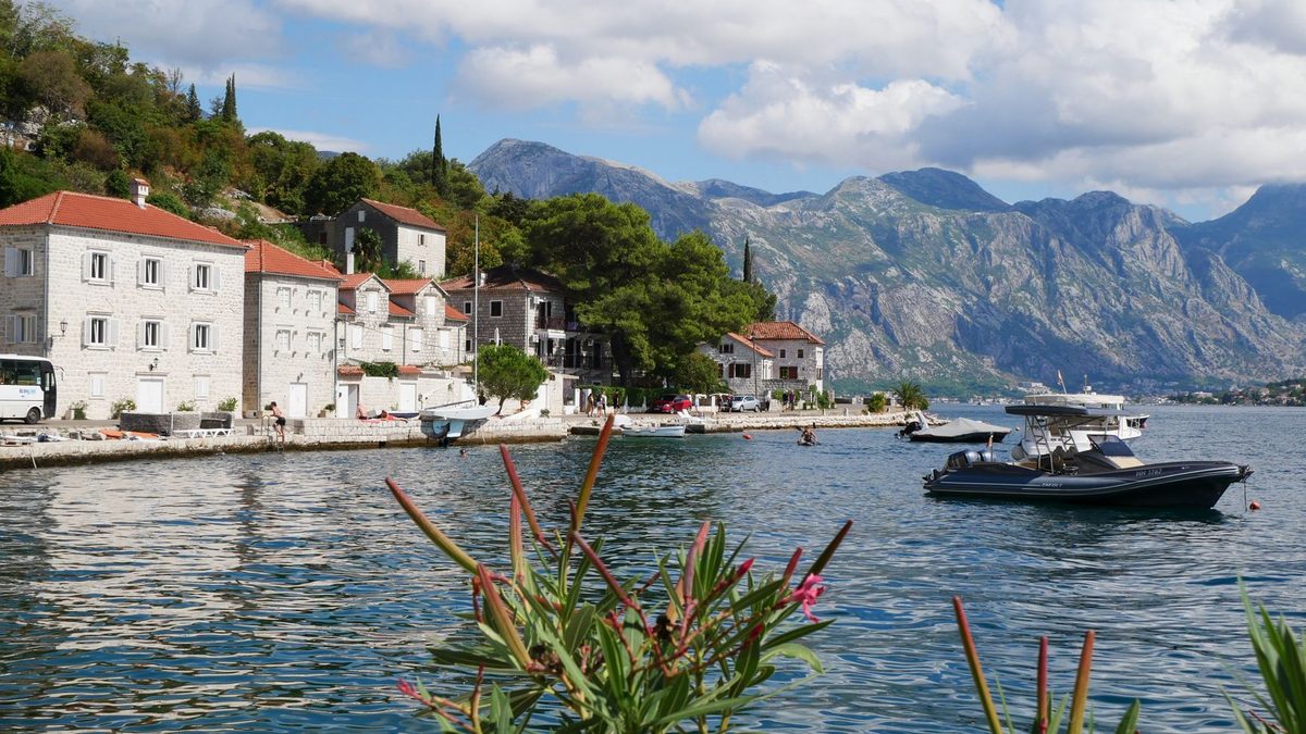 Boats on calm water by the Perast waterfront