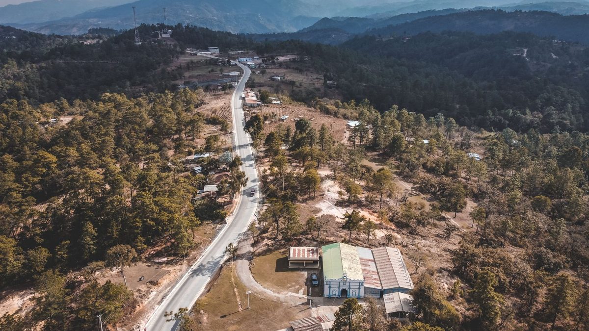 A winding highway through pine-covered highlands in Guatemala