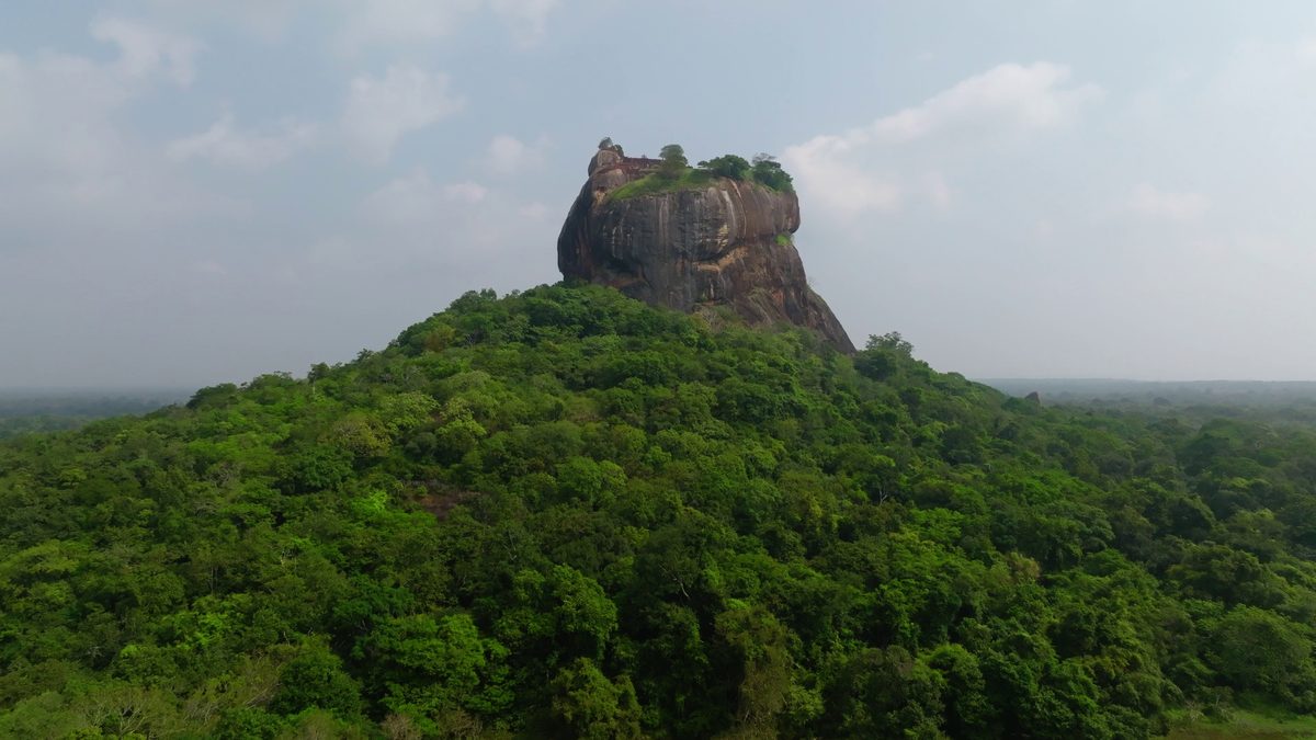 Sigiriya rock above the forest in the early morning