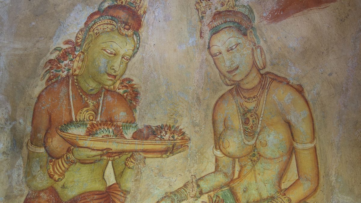 A fresco of two women, one holding a tray of flowers