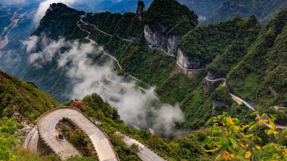 A road with many hairpin bends climbing Tianmen Mountain